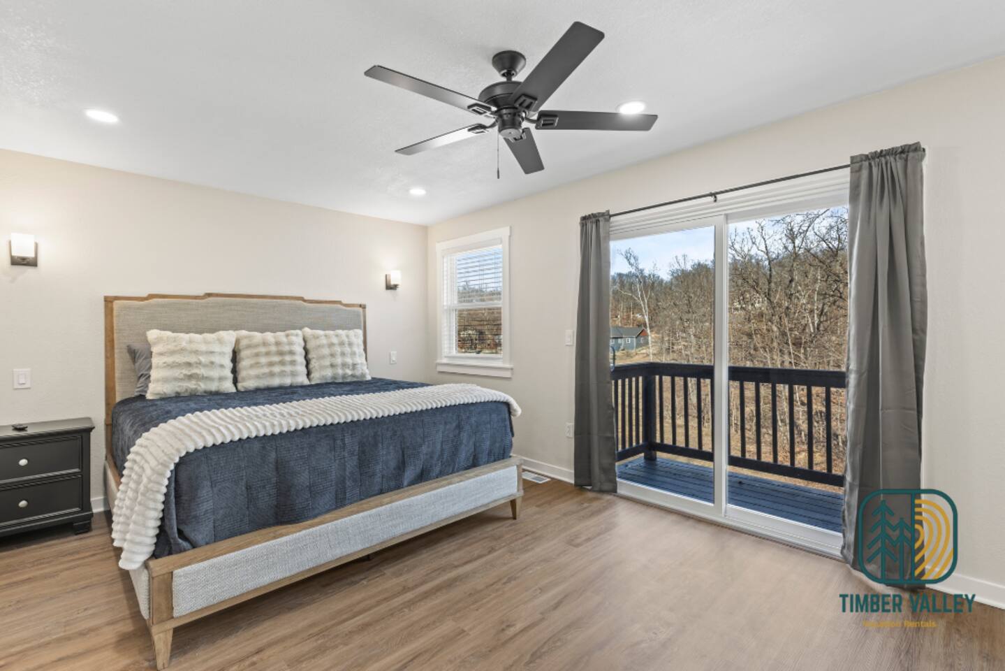 Bedroom with deck access at the Sunrise Beach lakefront house